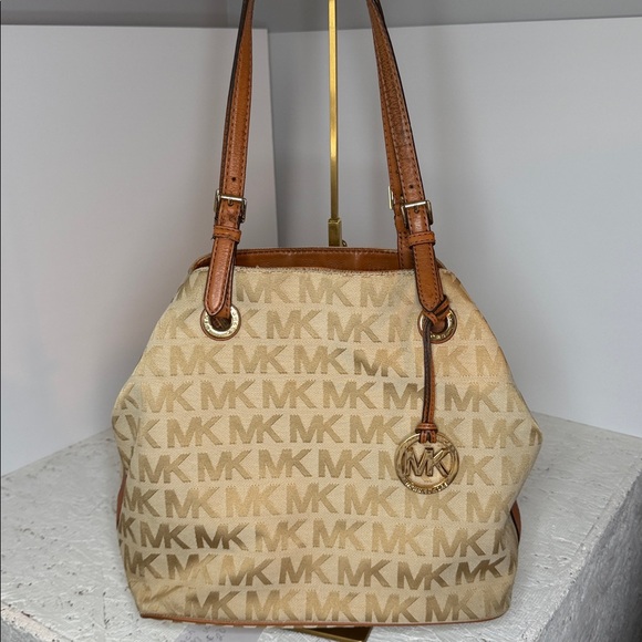 Michael Kors Handbags - Michael Kors signature logo tan bag with brown leather trim adj shoulder straps